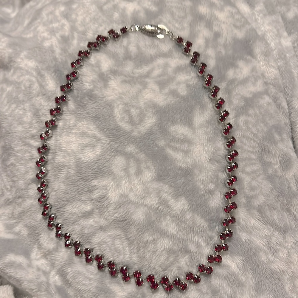 Red rube necklace with silver clasp.